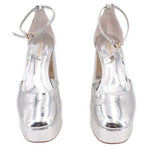 Pair of silver metallic ankle-strap platform heels with buckle detail