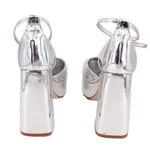Silver metallic platform heels with slingback strap and tall block heel