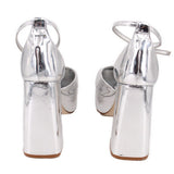 Silver metallic platform heels with slingback strap and tall block heel