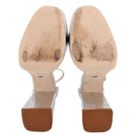 Silver metallic platform heels showing insoles and outsole tread