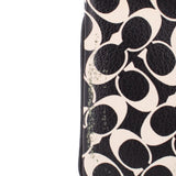 Logo canvas wristlet pouch close-up, textured black and cream pattern, stitched edge