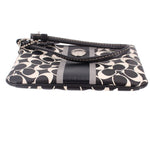 Signature stripe wristlet pouch side view, black trim and logo print, stripe panel