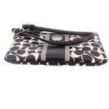 Signature stripe wristlet pouch side view, black trim and logo print, stripe panel