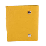 Yellow Ulysse PM notebook cover, front view with round metal button details