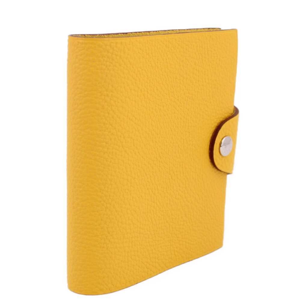 Yellow notebook cover, side view with snap closure and pebbled leather texture