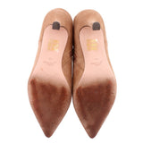 Camel suede ankle booties, view of insides with printed logo on lining.