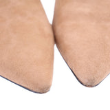 Camel suede bootie toe and side seam close-up, pointed shape, textured suede.