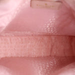 Pink satin-lined interior with monogram-style pattern and stitched logo panel