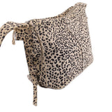 Leopard print mini crossbody bag side view with adjustable strap and structured shape