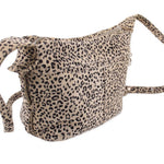 Leopard print mini leather crossbody bag with top zipper, front seams, and crossbody strap