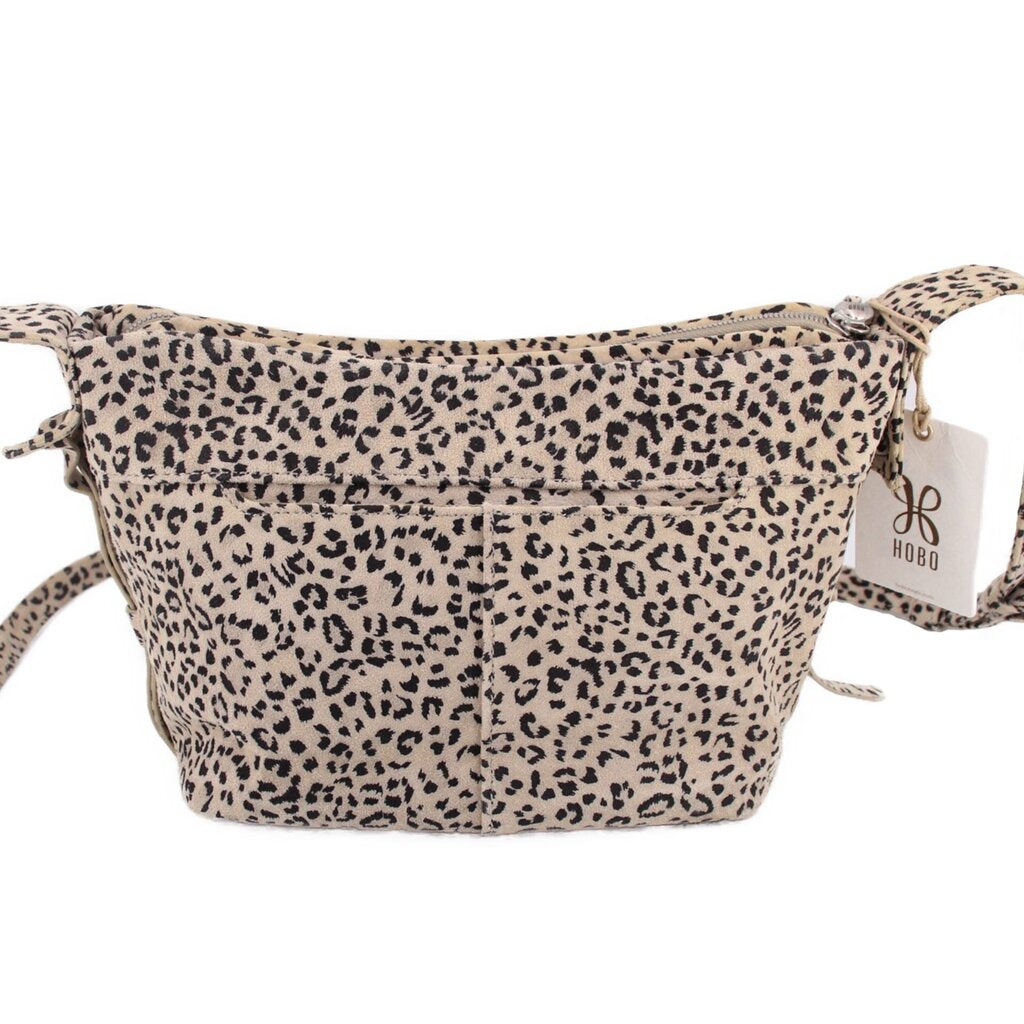 Leopard print mini crossbody bag with front zipper pocket and brand hang tag