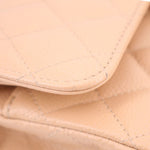 Tan inner fold close-up with quilted panels and contrast stitching