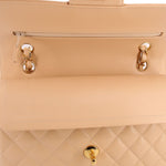 Open small double flap shoulder bag: top zip pocket and gold chain accents, tan