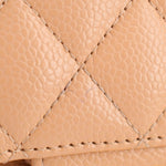 Tan quilted leather small double flap shoulder bag, stitched pattern detail