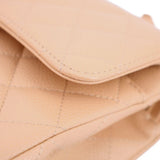 Tan flap edge close-up with curved border and fine stitching