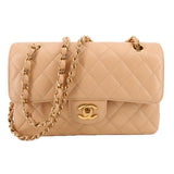 CHANEL Small Double Flap shoulder bag in tan, quilted leather with gold chain strap and logo clasp