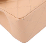 Tan quilted leather corner close-up with seam lines and edge stitching