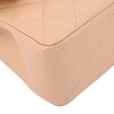 Tan quilted leather corner close-up with seam lines and edge stitching