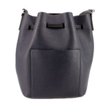 Navy bucket crossbody bag with front flat panel and studded drawstring tabs