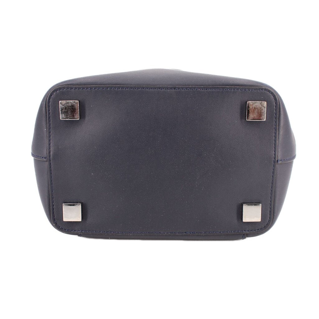 Navy leather mini crossbody bag with magnetic flap and square metal corner details