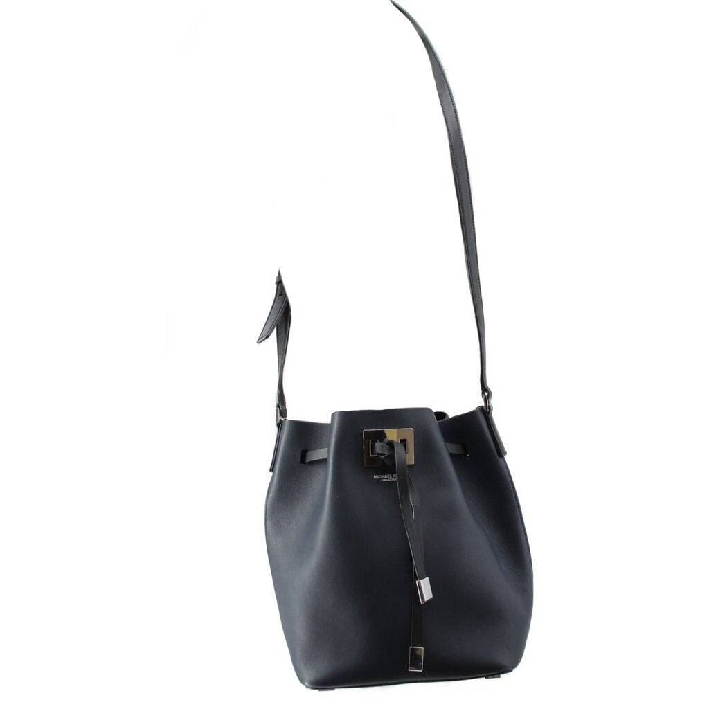 Navy leather bucket crossbody bag with front buckle accent and long adjustable strap