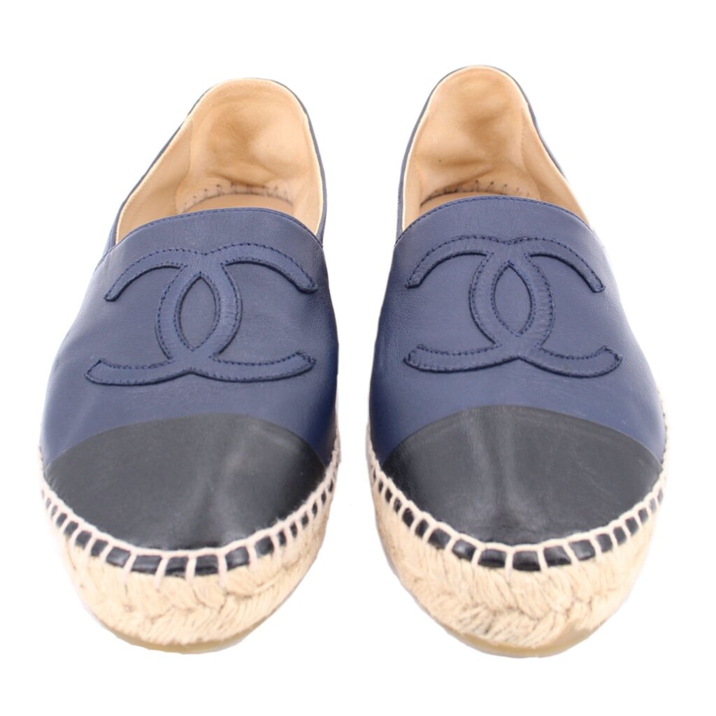 Pair of blue cap-toe espadrille flats with front logo embroidery and braided jute trim