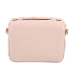 Cream Micro Pochette Metis crossbody back view with top strap and minimal hardware