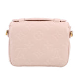 Cream Micro Pochette Metis crossbody back view with top strap and minimal hardware