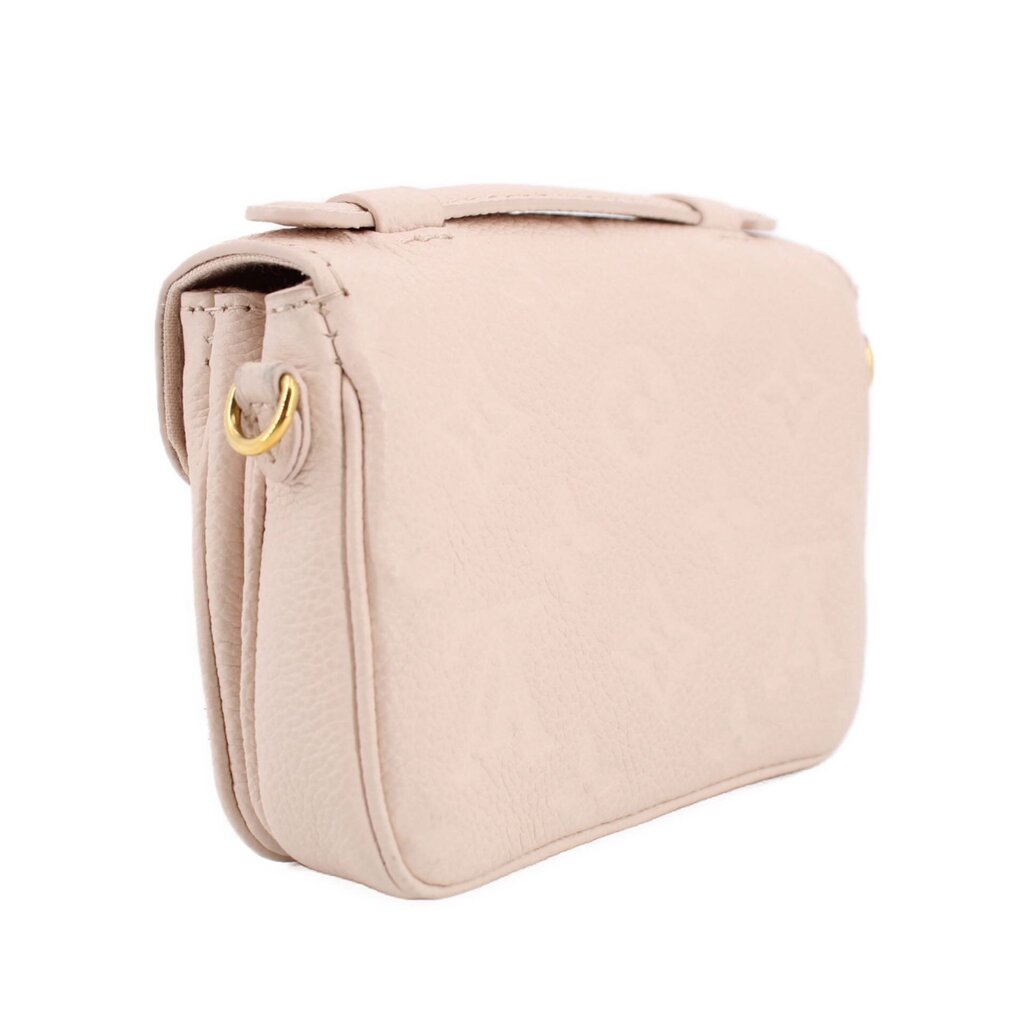 Cream Micro Pochette Metis crossbody profile with gold side rings and structured shape