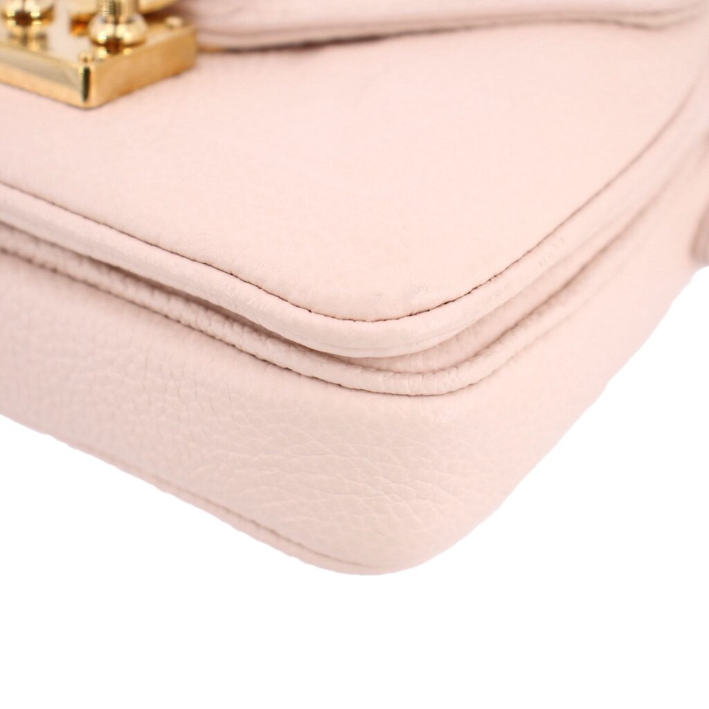 Cream Micro Pochette Metis crossbody bottom corner close-up with stacked edge seams