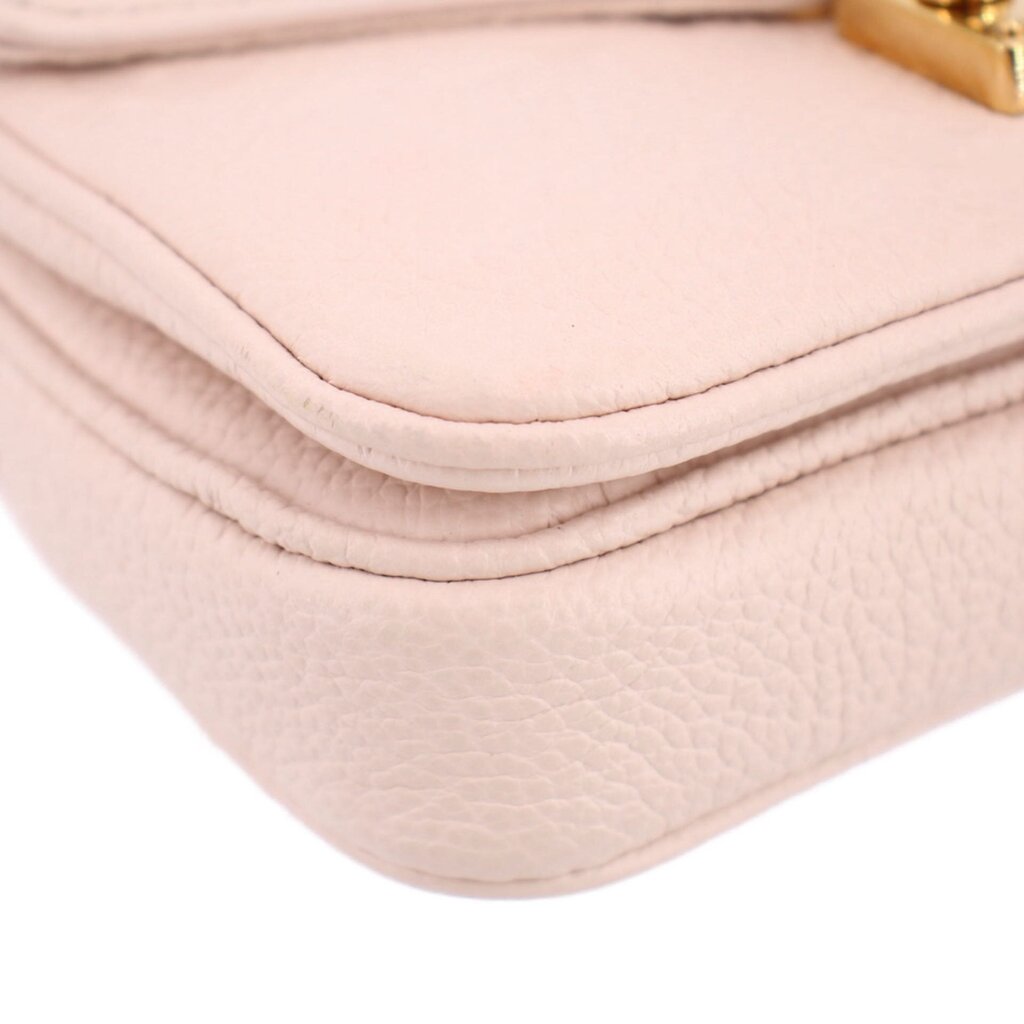Cream Micro Pochette Metis crossbody seam and corner close-up showing flap lining edge