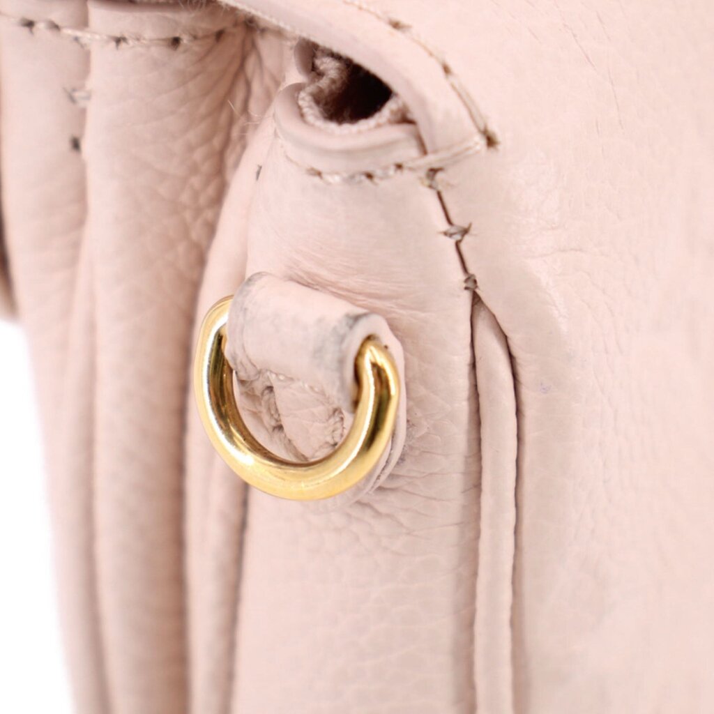 Micro Pochette Metis inside close-up with gold D-ring and woven strap loop