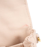 Cream Micro Pochette Metis canvas close-up with gold ring and stitching detail