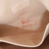 Micro Pochette Metis interior lining: cream fabric with small red speck pattern