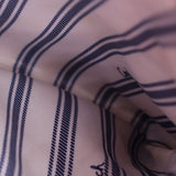 Blue-and-cream striped lining close-up inside the crossbody bag