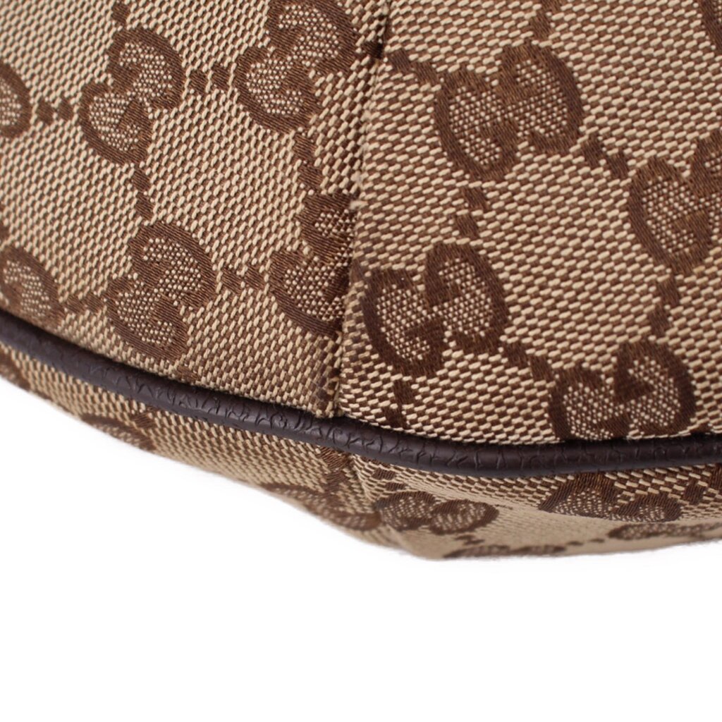 Brown GG canvas crossbody bottom edge with textured leather trim