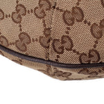 Brown GG canvas crossbody bottom edge with textured leather trim