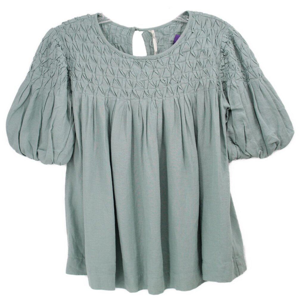 Light green blouse with smocked yoke, puff sleeves, and pleated bodice
