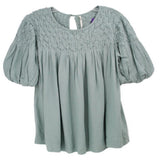 Light green blouse with smocked yoke, puff sleeves, and pleated bodice