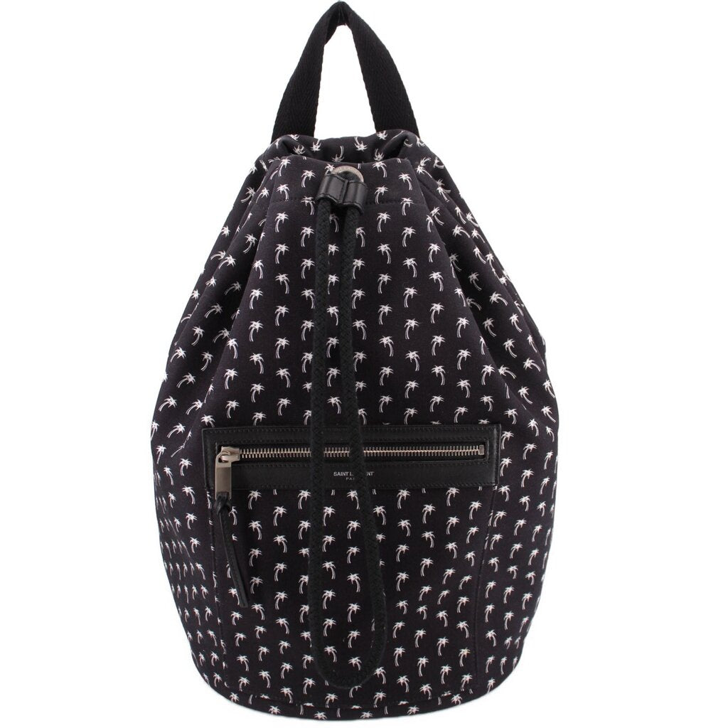 Black backpack with white palm pattern, drawstring top, front zip pocket and leather pull tab