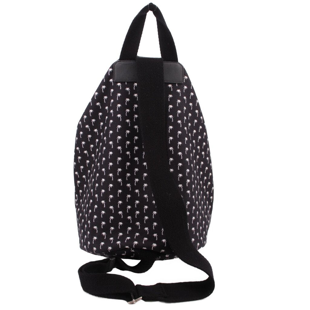 Black palm-print backpack back view with top carry handle and adjustable strap with clasp