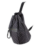 Black palm-print backpack, 3/4 view with drawstring cords and front zip pocket