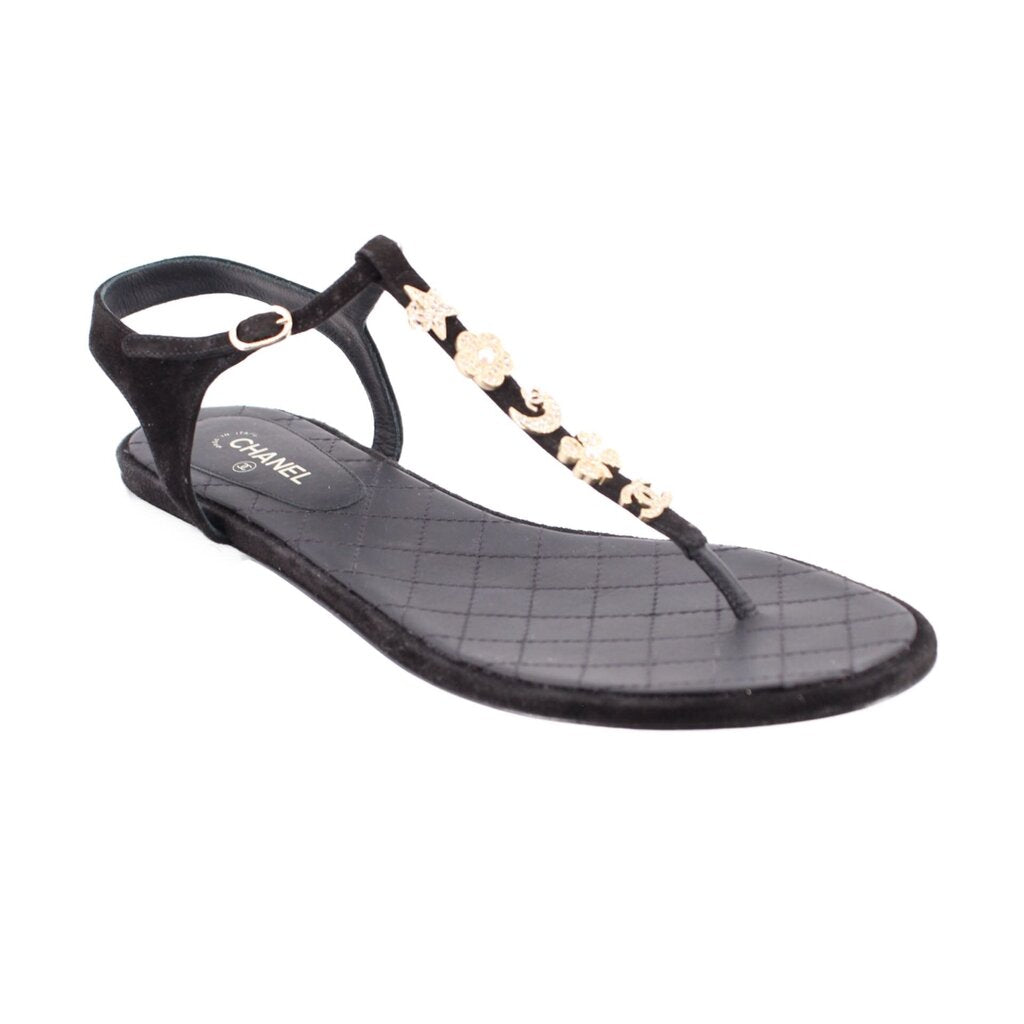 CHANEL black thong sandals with quilted footbed and gold charm strap detail
