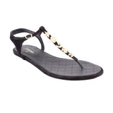 CHANEL black thong sandals with quilted footbed and gold charm strap detail