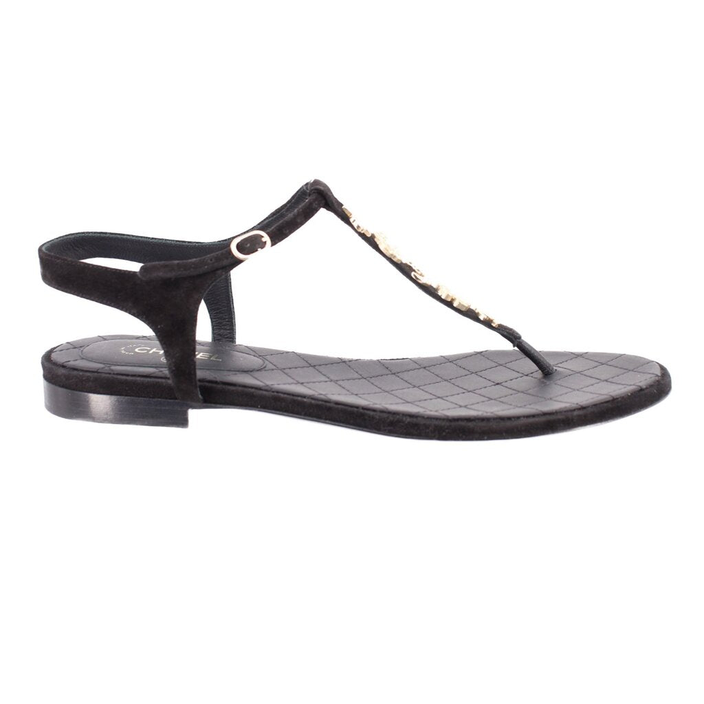 CHANEL black thong sandals with low heel and gold charm ornament on strap
