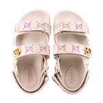 Pair of cream sandals with rhinestone straps and gold-tone GG buckle at instep