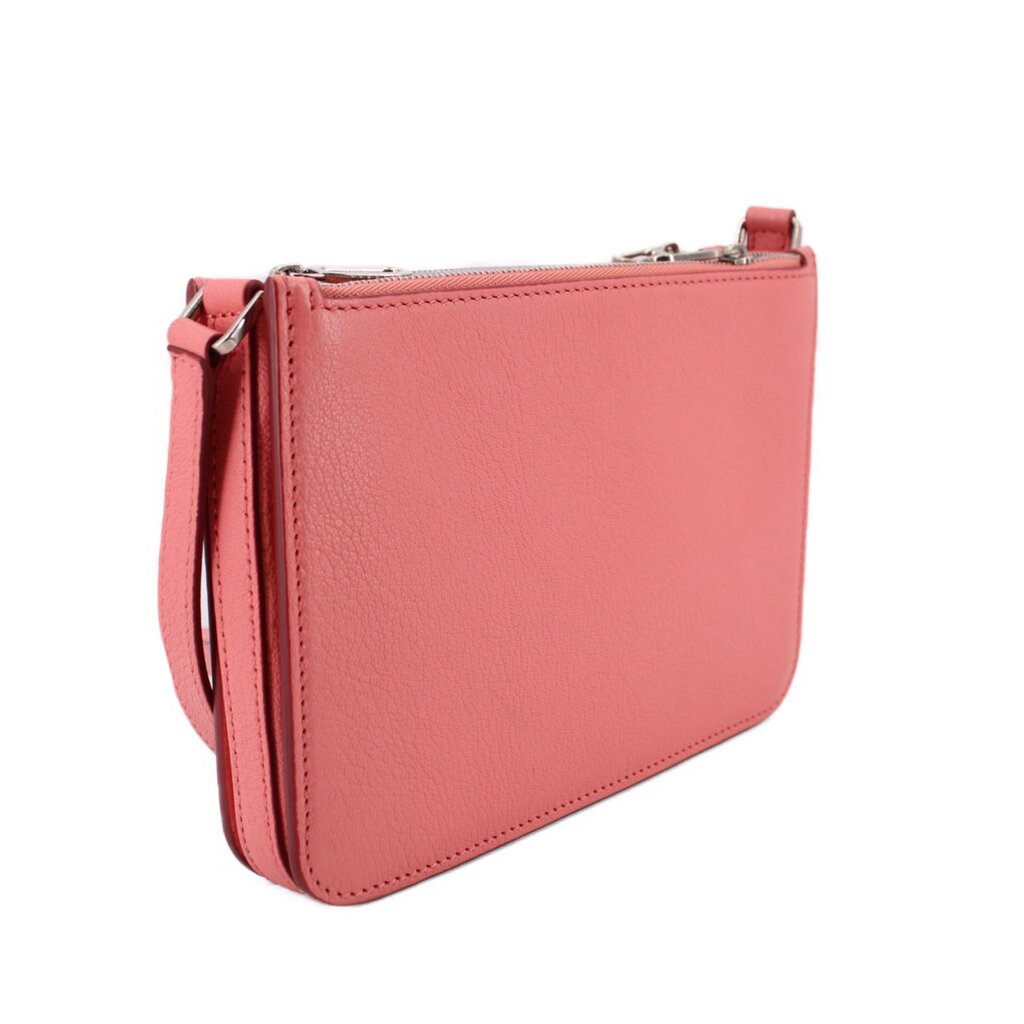 Pink crossbody bag with textured finish, top zip, and adjustable crossbody strap