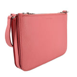 Pink crossbody bag, textured leather, top zip closure and slim shoulder strap