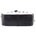 Black back panel of the two-tone camera crossbody bag with top zipper