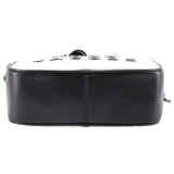 Black back panel of the two-tone camera crossbody bag with top zipper
